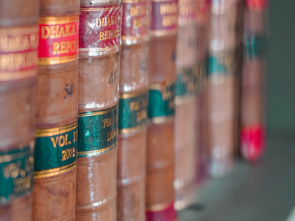 Tall shelves filled with books in a warm interior